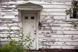 damaged front door due to mold and asbestos